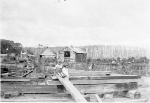 The loco shed (centre) near the mill, with the old chaff house and the hut known as Buckingham Palace to its left in the background. 