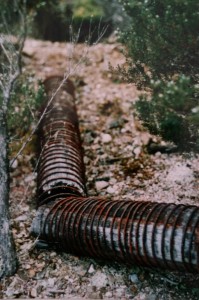 Wooden sluicing pipes, Iris tin mine, 1990s.